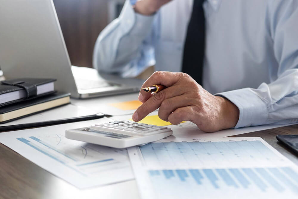 business woman using calculator