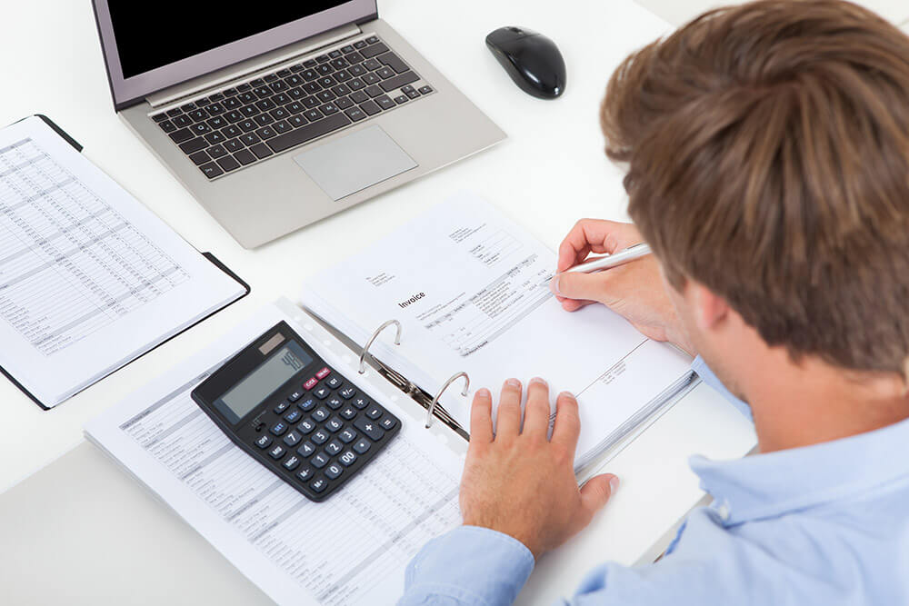 business woman using calculator